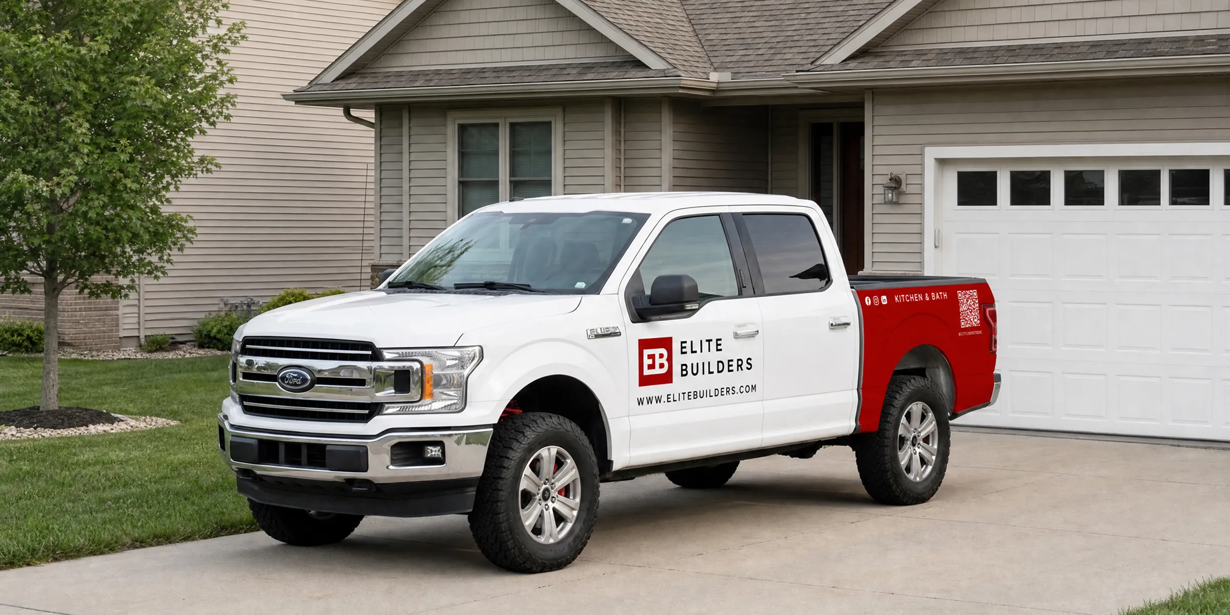 Elite Builders branded work truck parked in a residential driveway